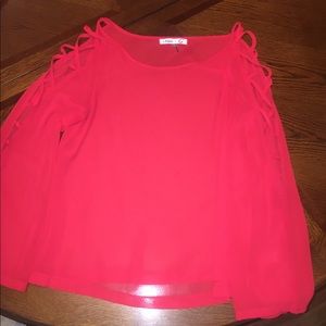 Red sheer top with intricate cut out arms