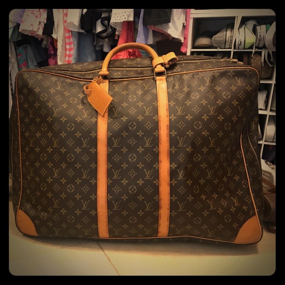 Louis Vuitton monogrammed Sirius soft suitcase