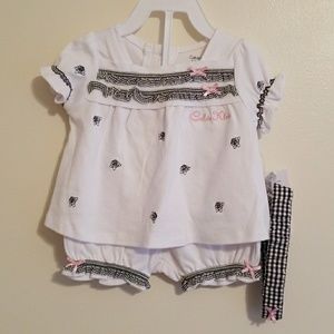 Calvin Klein outfit with shirt, shorts, & headband