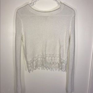 Cropped sweater with crochet detail