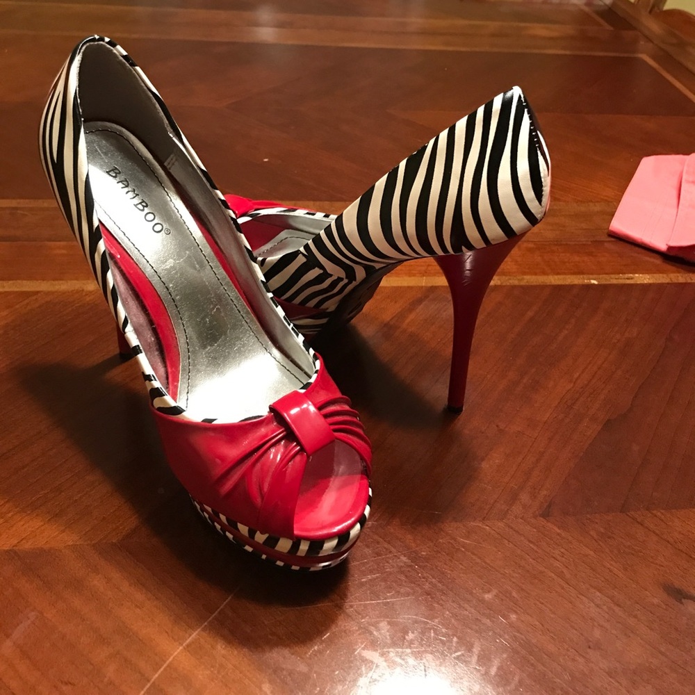 Black and white zebra print heel with red accents!