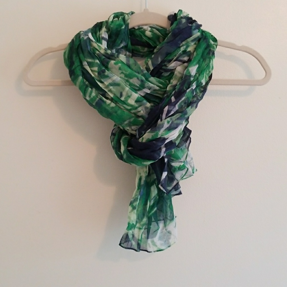 Scarf with great green, navy, and white pattern.