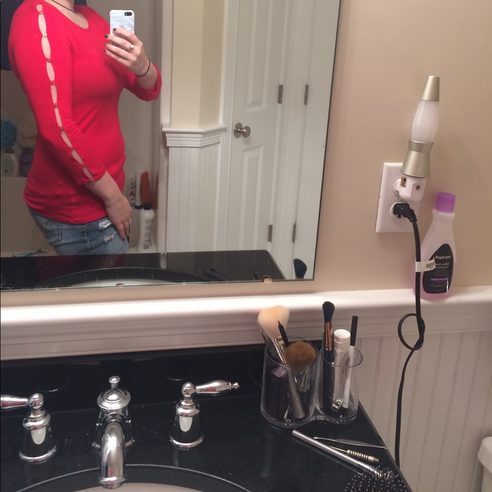 Red top with ripped sleeves