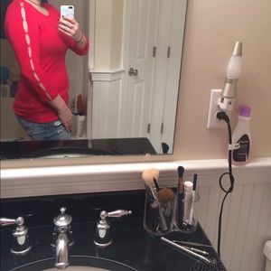 Red top with ripped sleeves