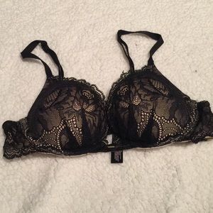 Black lace over nude push up bra