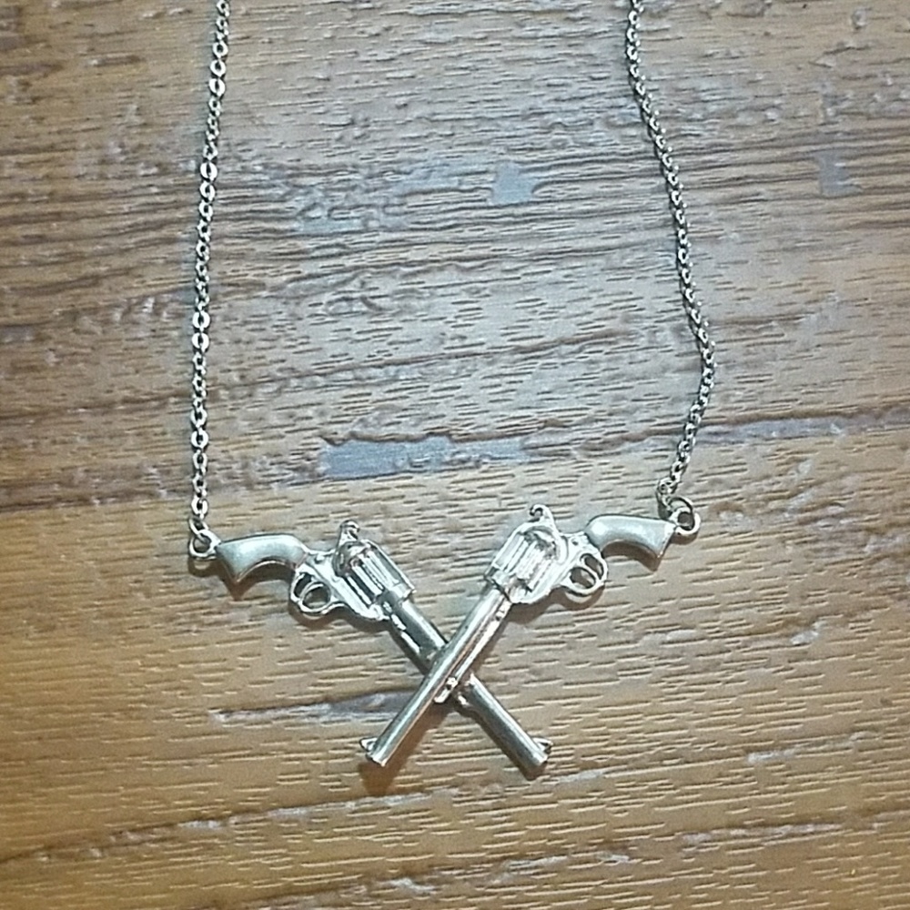 Crossed revolvers necklace