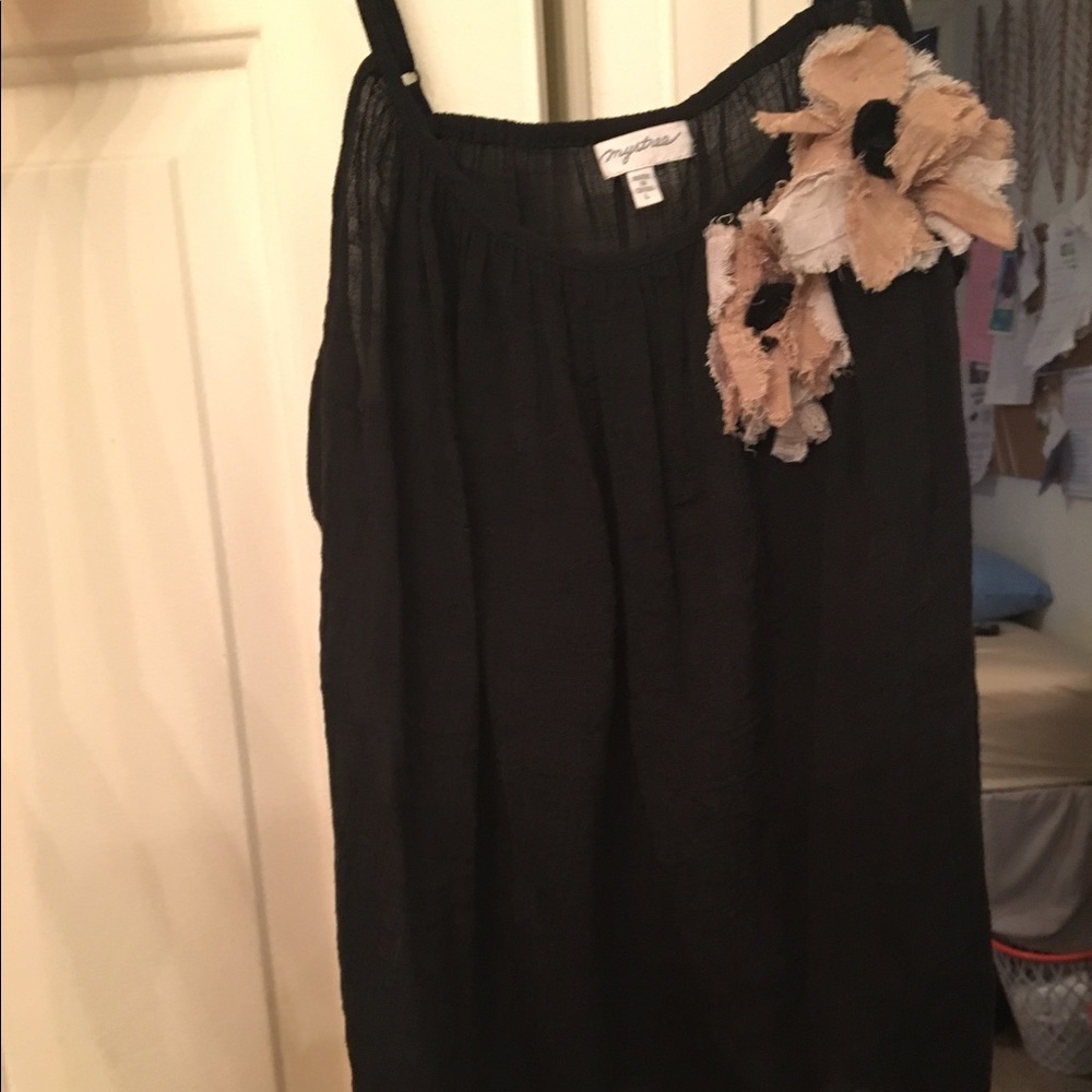 Dark navy blue top with tan flowers.