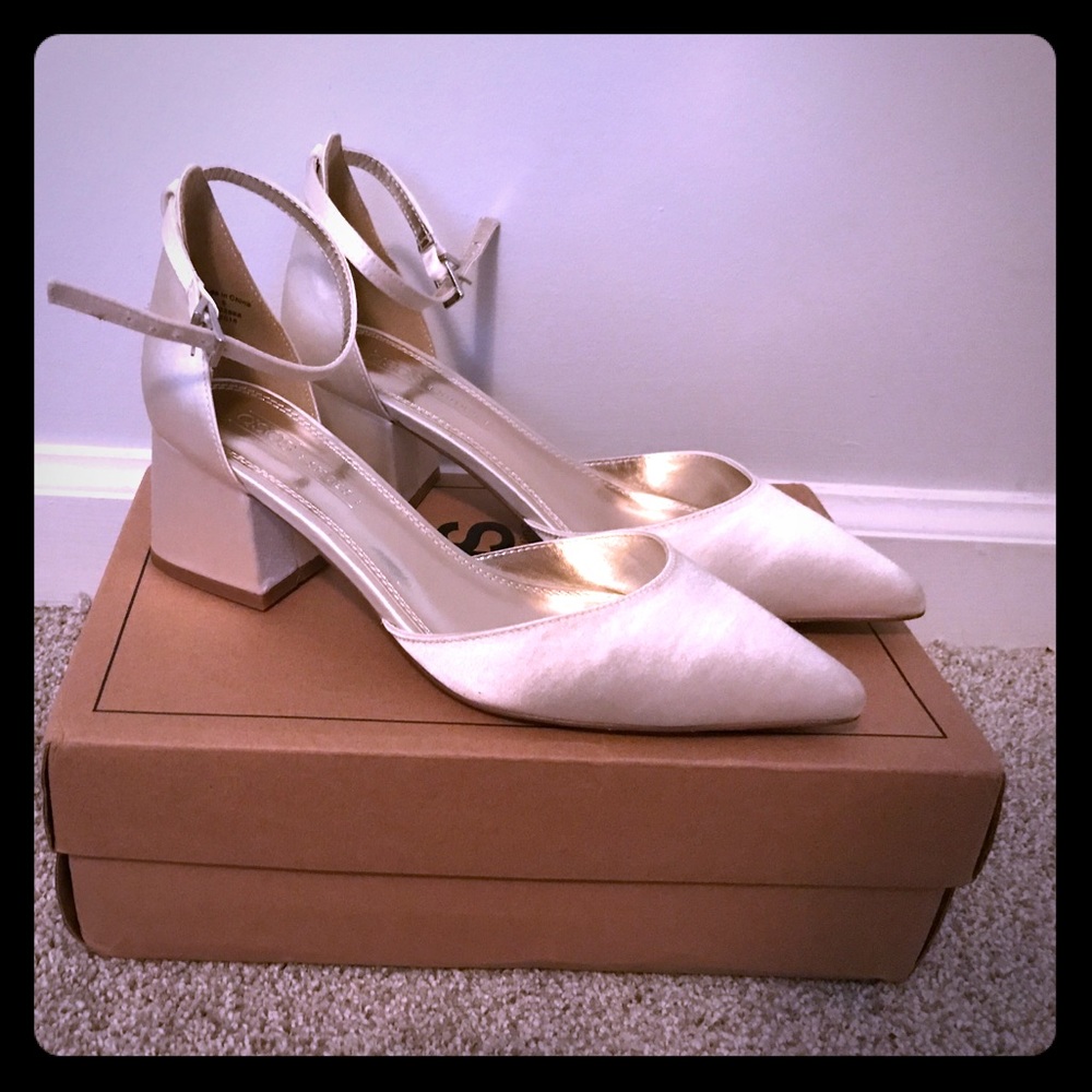 Ivory satin pointed toe pumps with low, chunk heel