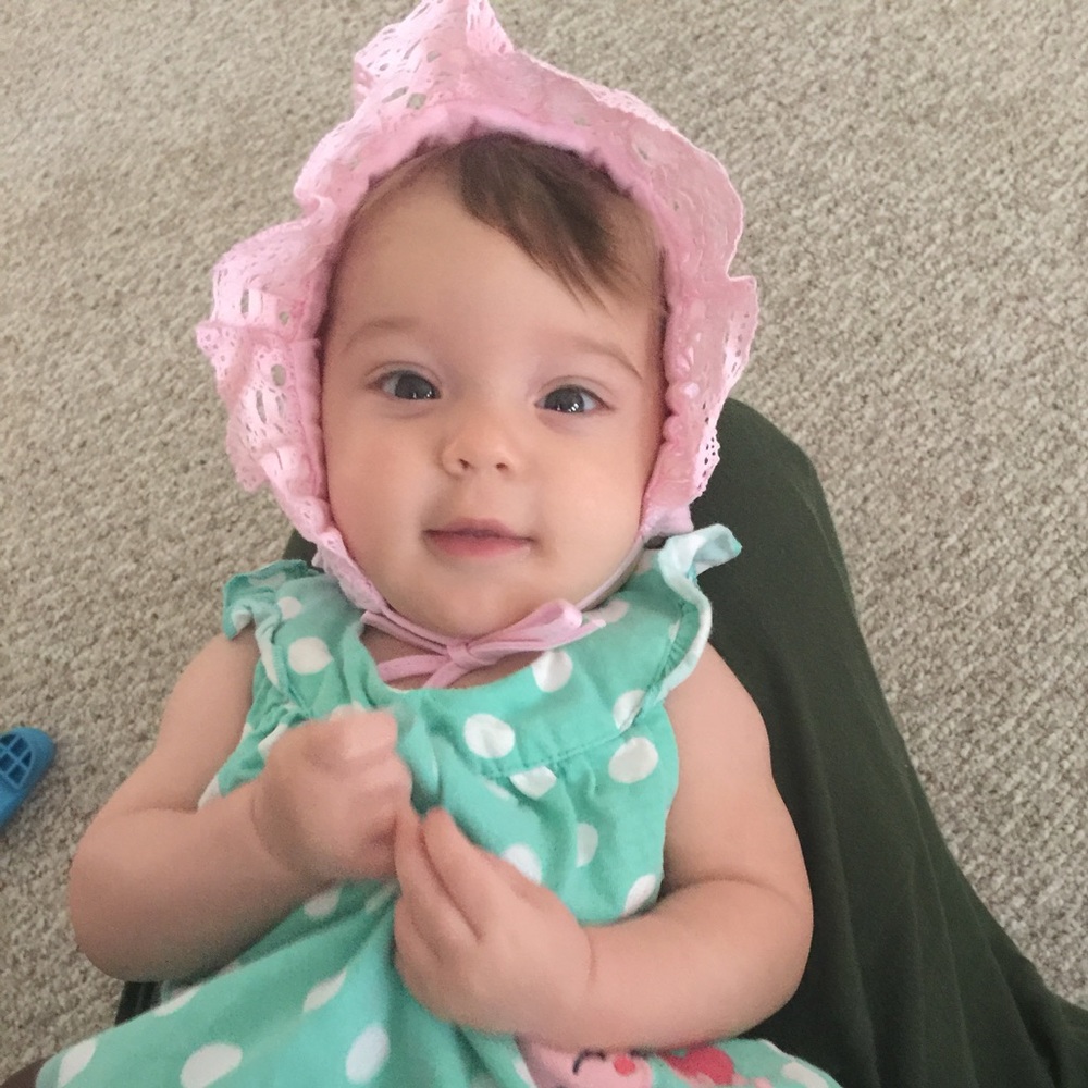 Smocked light pink baby bonnet