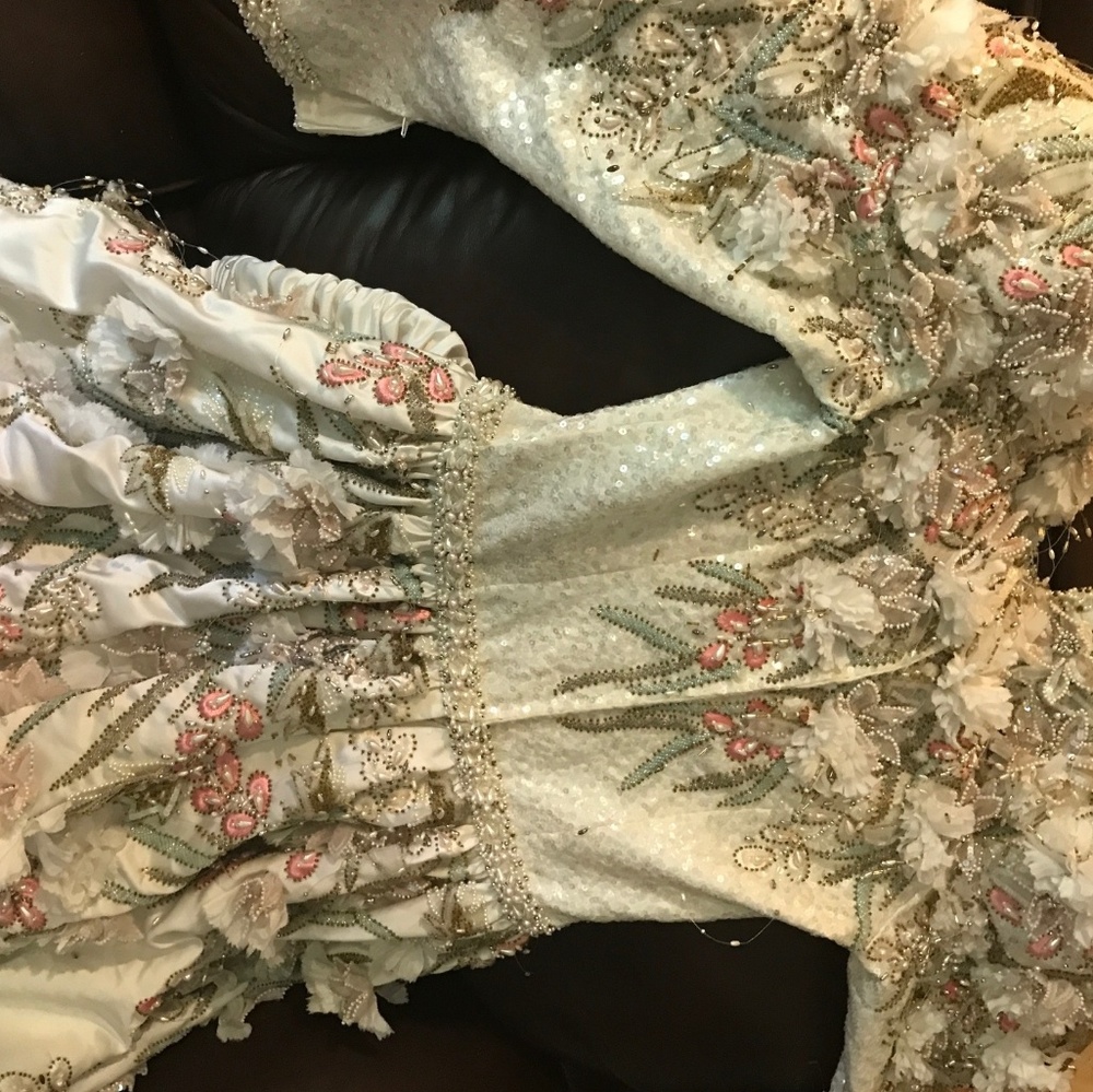 Haute couture wedding dress. Needs dry cleaning.