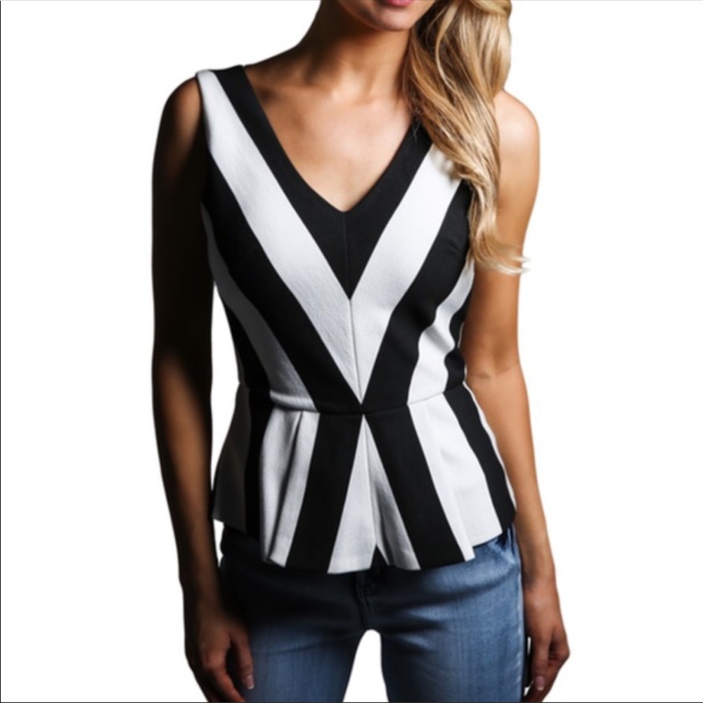 Very cute, striped peplum shirt. Size M.