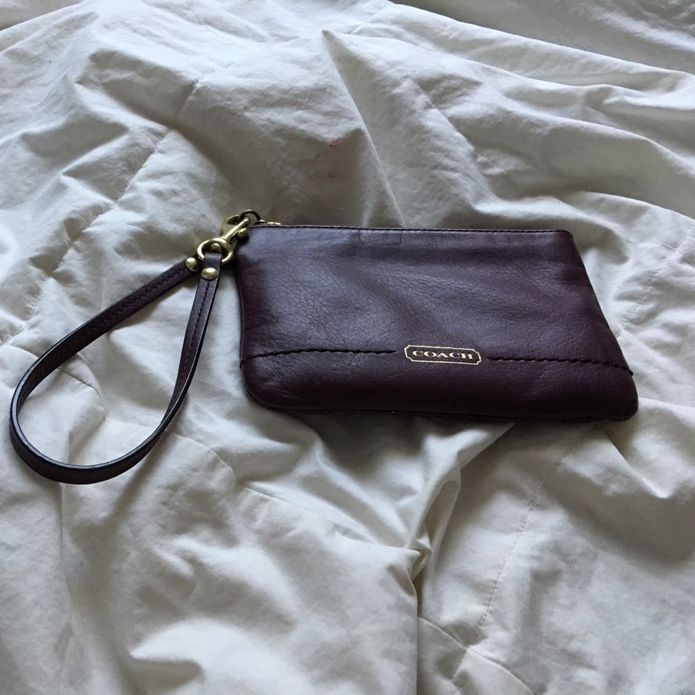 Coach Burgundy wristlet with gold accents!