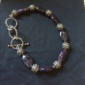 Silver tone and purple bead bracelet