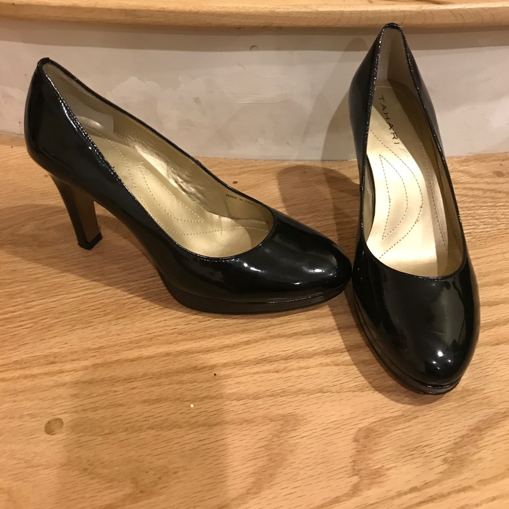 Black patent pumps with gold embellishments