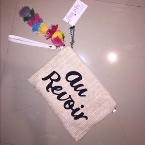 "Au Revoir" clutch with Pom Pom detail "Au Revoir" clutch with Pom Pom detail 