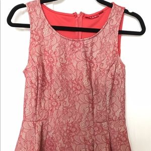 Coral peplum sleeveless top