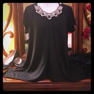 2x black top with embellished neckline.