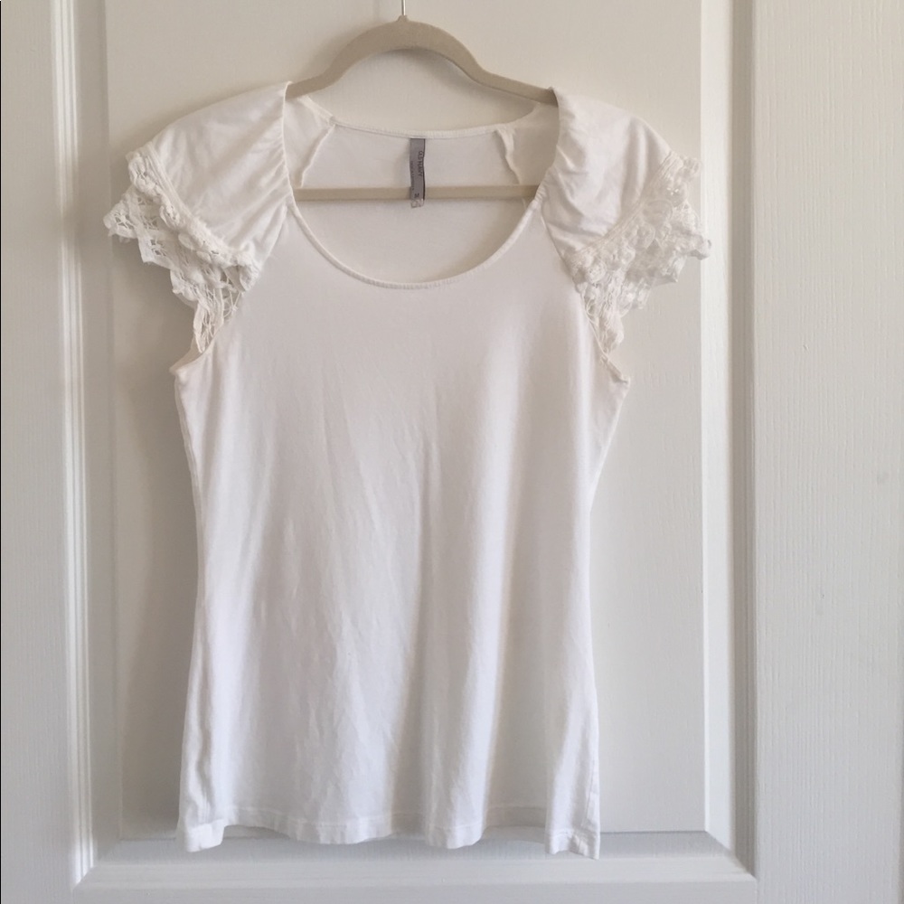 White top with ruffle sleeves.