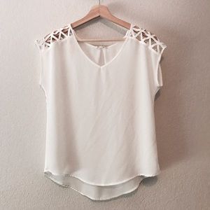 White blouse with cut out triangle sleeve details