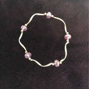 Silver bracelet with purple beads