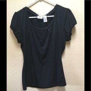 Black short sleeve fitted blouse. Very flattering.