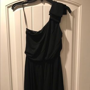 Black one shoulder dress.