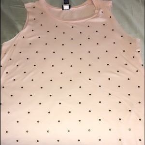 Peach tank top with bronze metal embellishments.