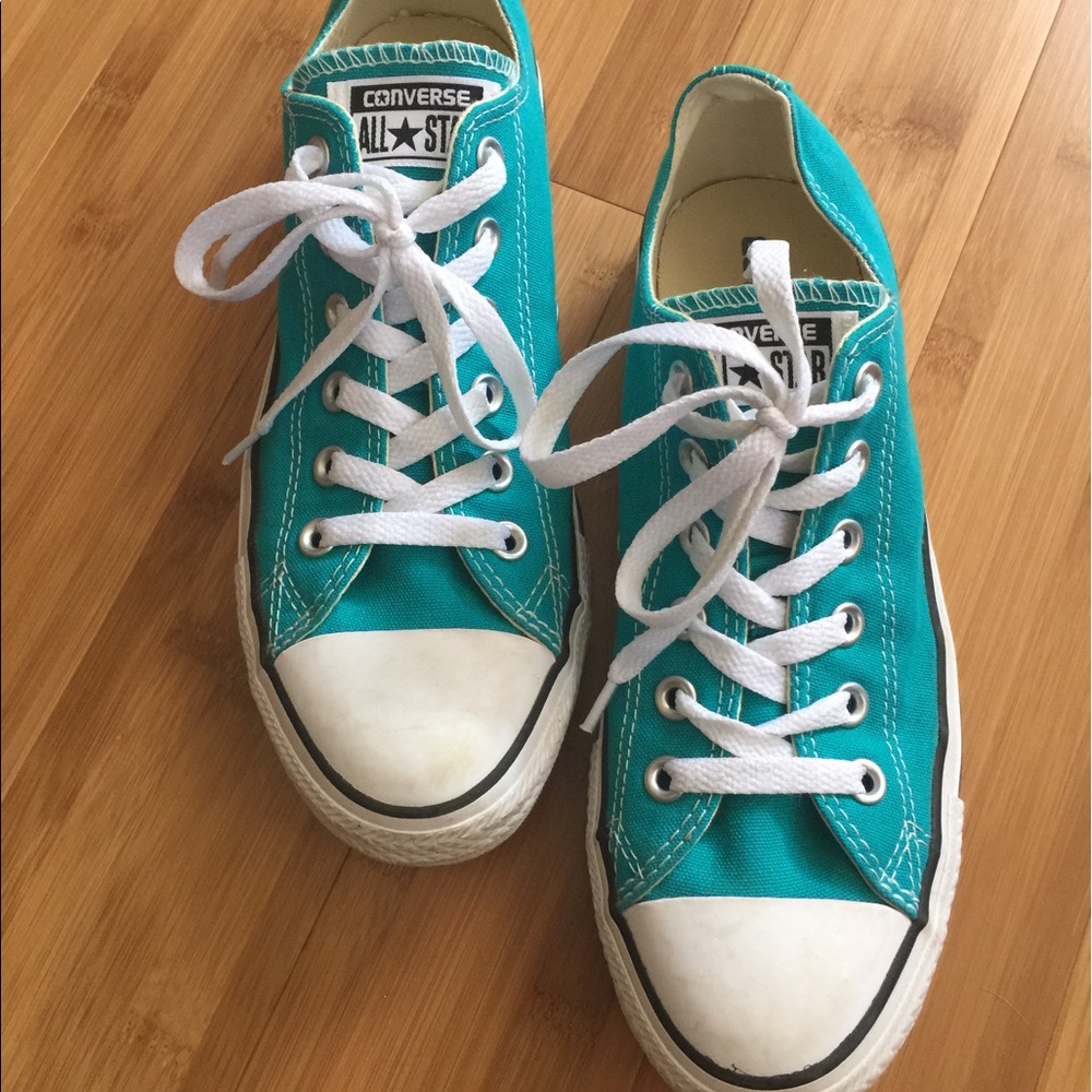 Teal CONVERSE canvas lace up sneakers.