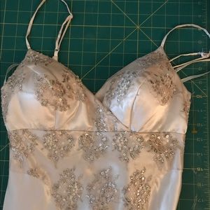 Ivory sheath style wedding dress.