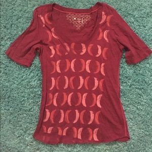 Woman's purple v-neck skate shirt.