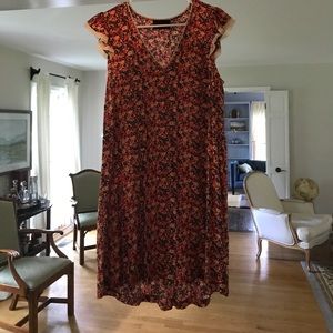 Floral dress with flutter sleeves.