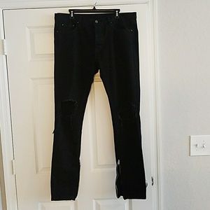 Slim black denim distressed knees w/ ankle zippers