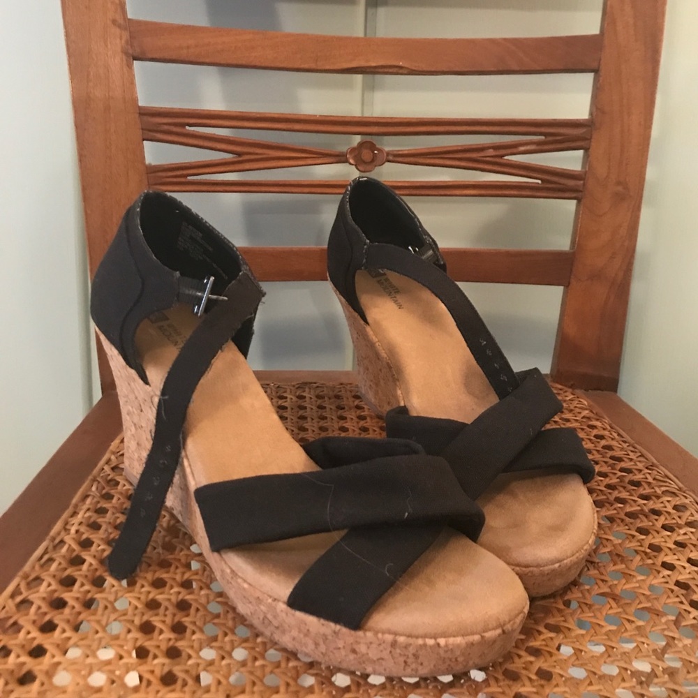 Black strappy cross cross cork wedges
