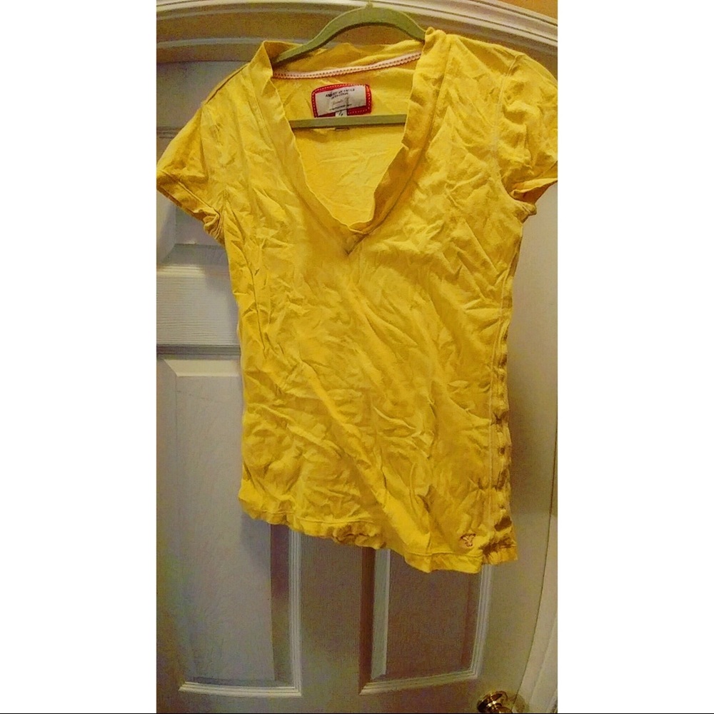 Yellow v neck shirt