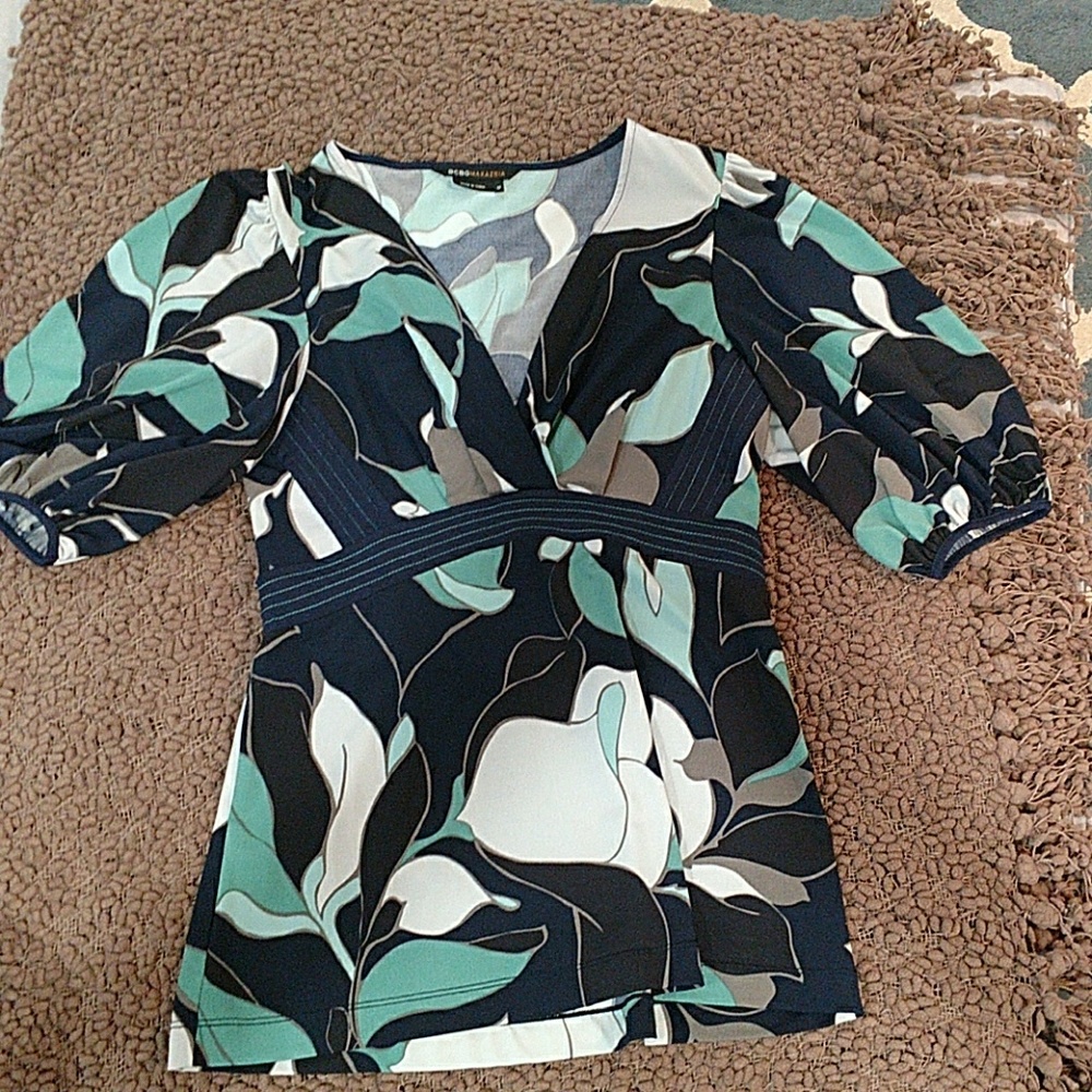 Beautiful 3/4 sleeve V neck blouse. Worn once.