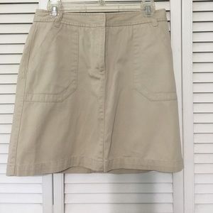 Khaki colored skirt side pockets front zipper