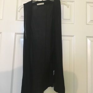 A loose black vest