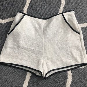 White Lush shorts with black faux leather piping