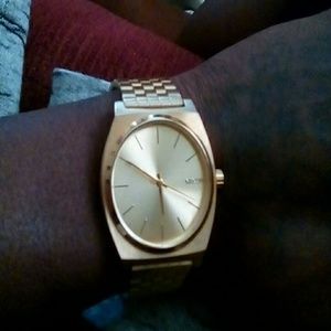 A Nixon men's gold watch 16G