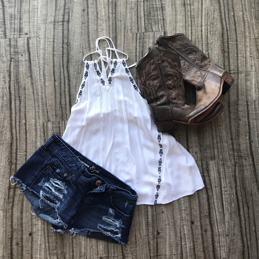 White top with blue embroidery