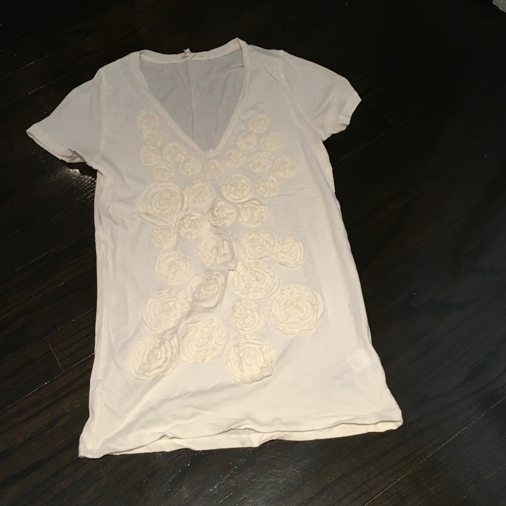 Cream shirt with rosettes on the front