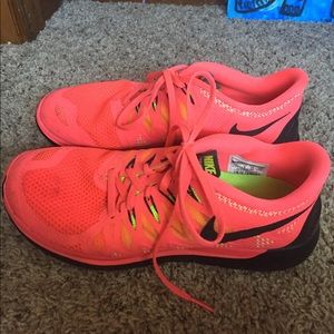 hot pink nike free 5.0 running shoes.