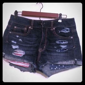 A dark blue American Eagle ripped short.