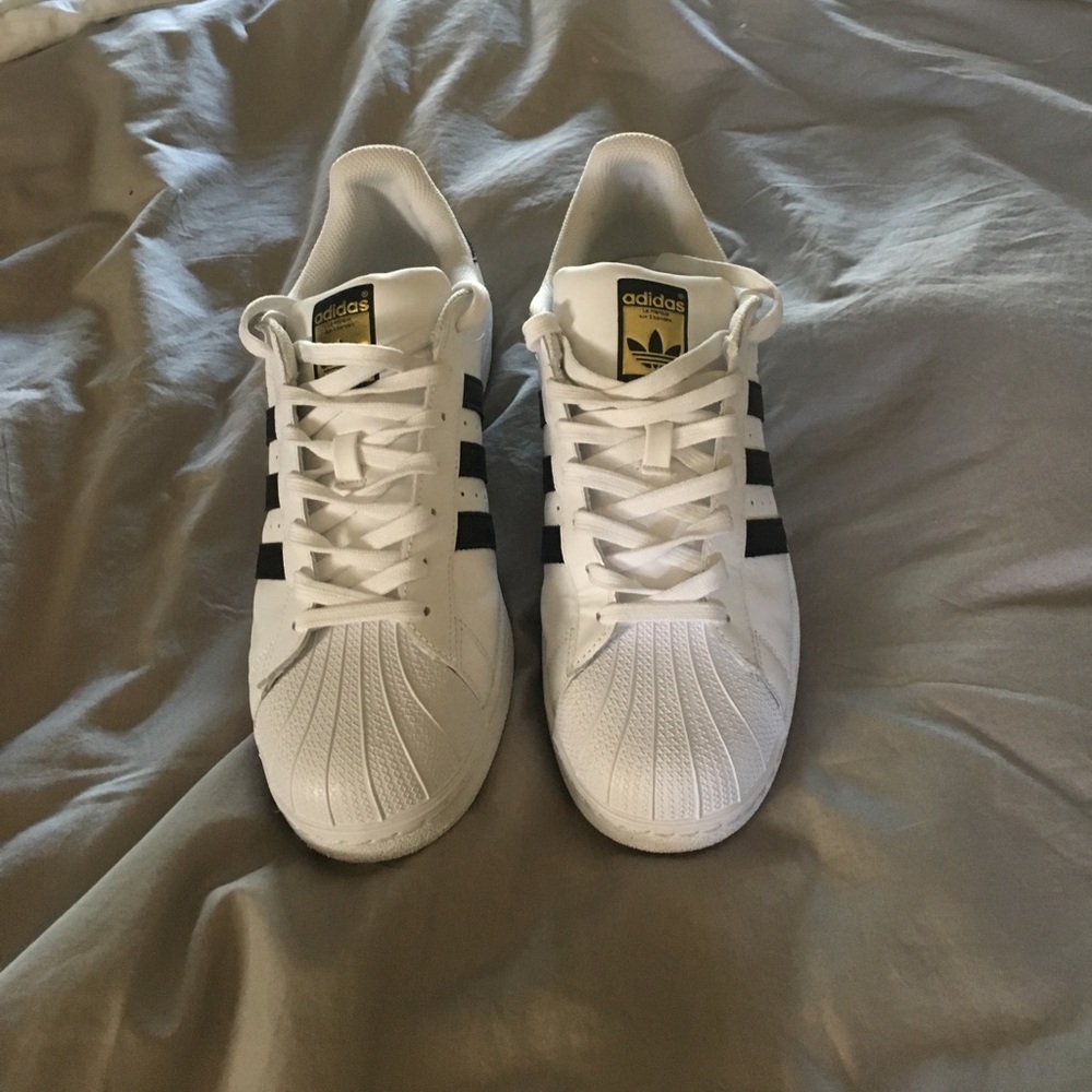 Men's white superstars with gold