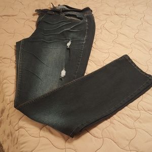 Distressed denim jeans with paint splash