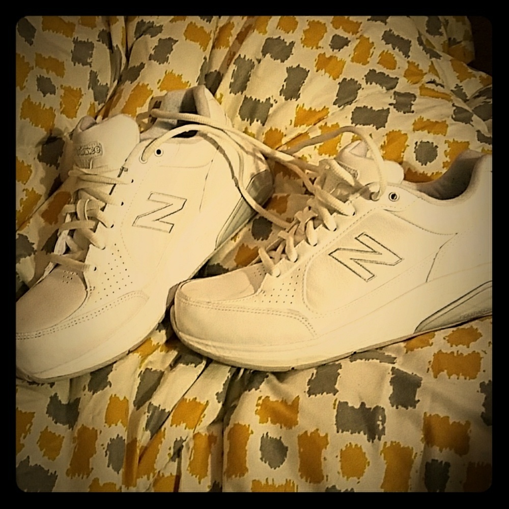Plain white New Balance sneakers