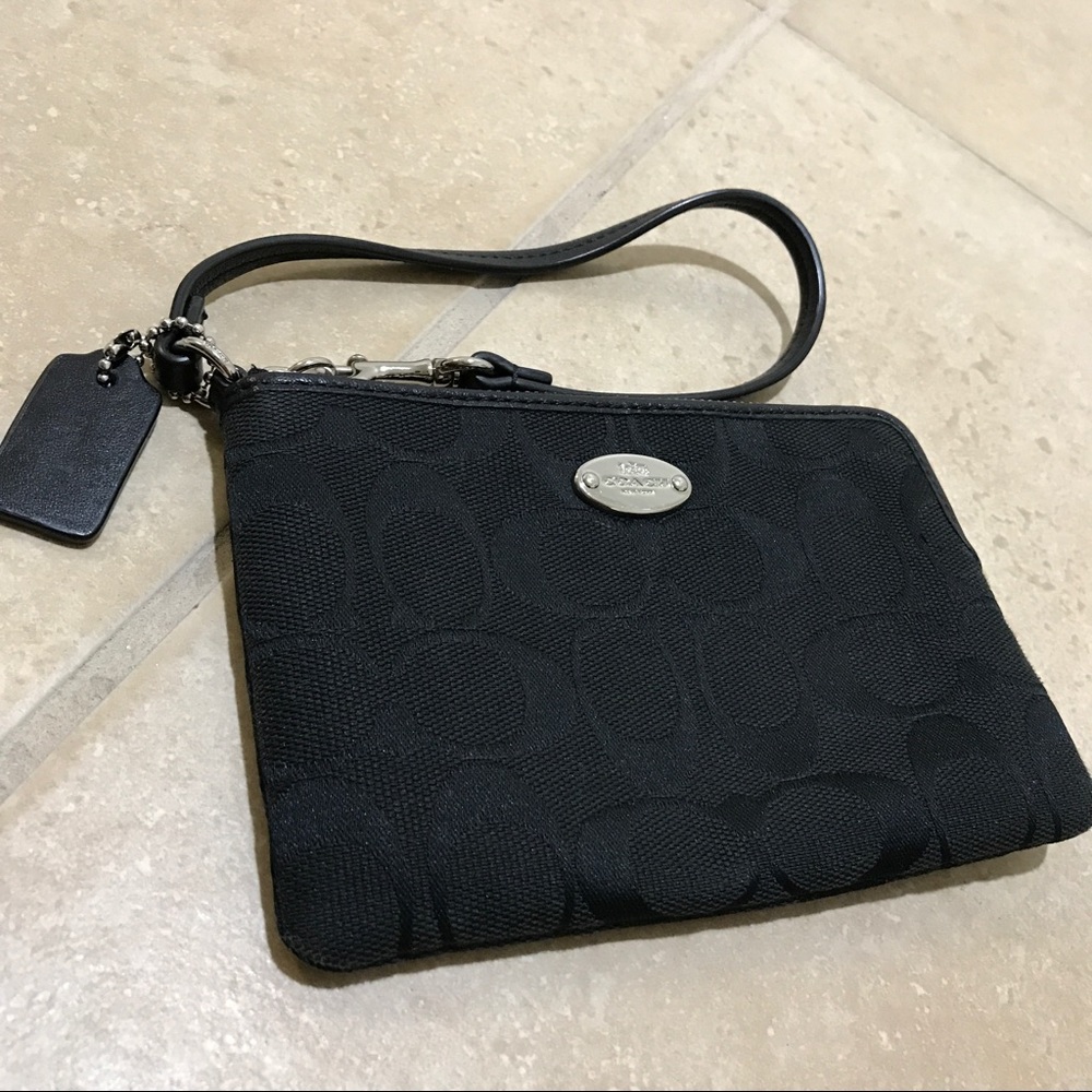 Black classic Coach wristlets