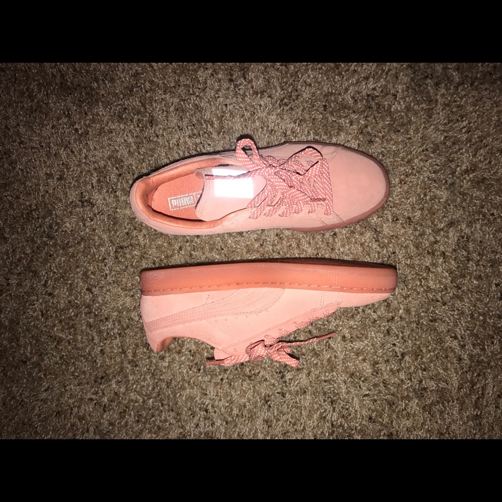 Pink suede Pumas