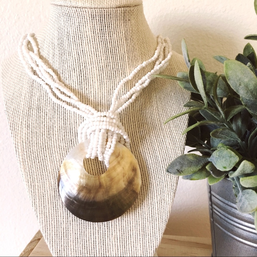 Abalone shell necklace with white beaded strands