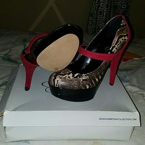 Snakeskin red pumps